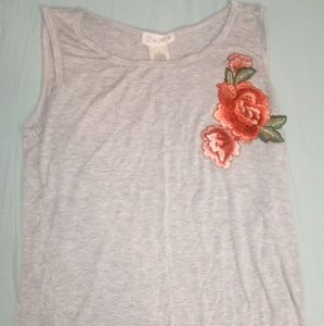 Light gray tank top with flower patch